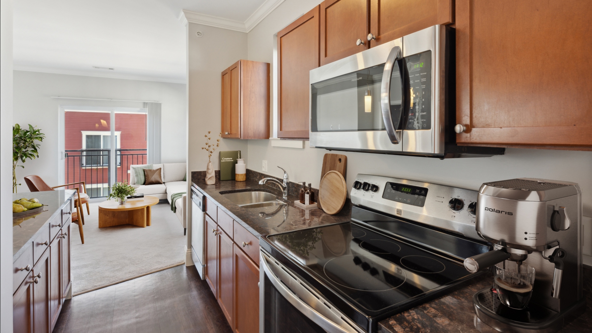 Kitchen with living room in background