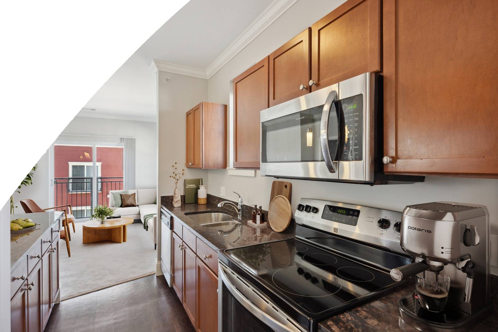 VillageAtTaylorPond_INT_Apartments_KitchenCloseUpWithLivingRoomInBackground_Spotless